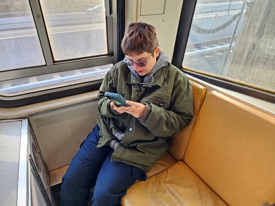 Elyse checks something on her phone while we ride car 2056 to Reston Town Center station.