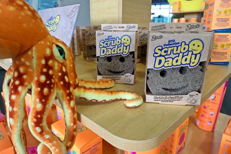 Woomy reaches out to touch the Scrub Daddy Eco Collection sponges.