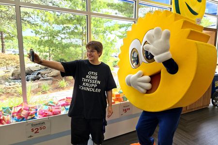 Elyse gets a selfie with the Scrub Daddy mascot.