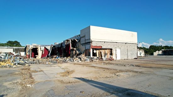 The movie theater building itself has been partially demolished, as the interiors of some of the theater spaces are now visible.