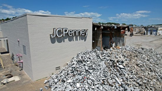 Southeastern corner of the JCPenney building. The sign is still intact, but just about everything else on the east facade of the JCPenney building is gone.