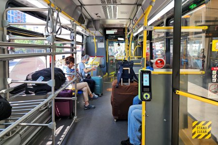 The interior of our bus.  Note the luggage racks, indicative that this bus is specifically intended for the airport route.