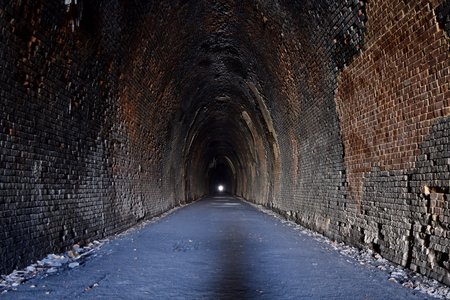 Looking down the tunnel from the west portal, with the east portal in the distance.