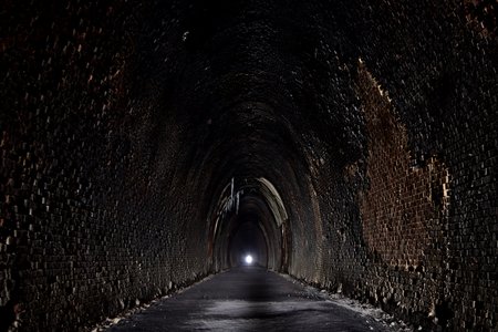 Looking down the tunnel from the west portal, with the east portal in the distance.