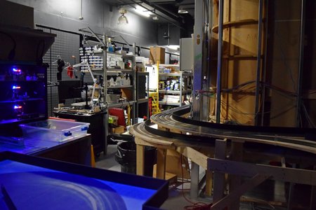 A glimpse through a window of some of the back areas of the attraction.  This is where some of the moving things like cars and trains turn around and/or reverse ends, and where things get pulled off the line as needed.