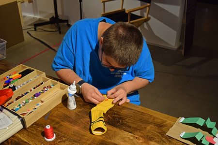 Elyse sat down at this little workshop bench that the Myseum provided and made a sock puppet while I photographed.