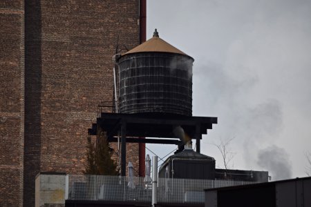 Water tower on top of a building near the intersection of 7th Avenue and West 26th Street.