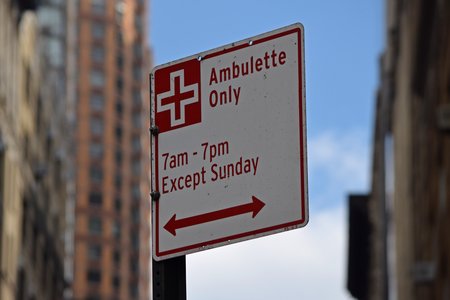 "Ambulette Only" signage on West 26th Street, just past the intersection with 7th Avenue.