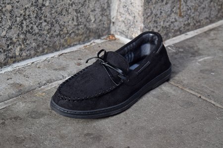 A random loafer on the sidewalk near the entrance to the Whole Foods.