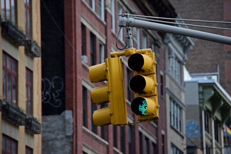 New York City-style traffic signal at the intersection of 7th Avenue and West 24th Street.