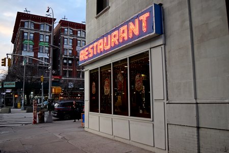 Various shots of the sign on the restaurant's south facade, focusing on the sign.