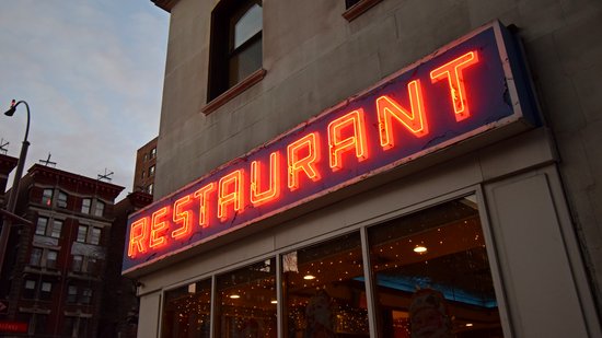 Various shots of the sign on the restaurant's south facade, focusing on the sign.