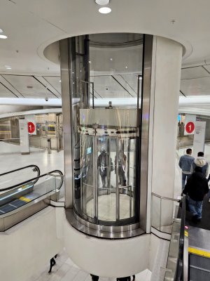 I absolutely loved this elevator.  It only went between two levels, but it was round, plus it also was suspended a few stories above the main floor of the mall.  I had never seen an elevator situated like this before.