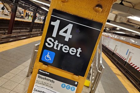 Signage on a column at 14th Street station.  I sort of like this angle.