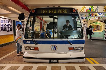 Elyse sits in the driver's seat of an RTS bus.