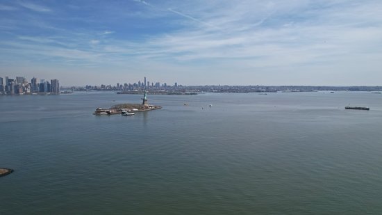 The Statue of Liberty, Ellis Island, and the New York skyline.