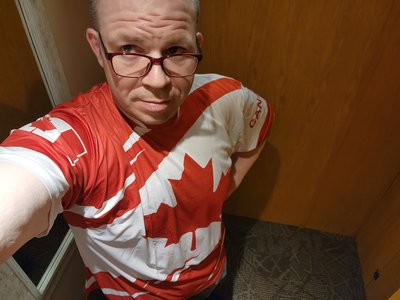Trying on a Canada shirt at the duty-free store before going back into the US.  I did end up buying this shirt, because why not.