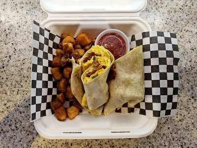 My lunch from Urban Crave, which consisted of a breakfast wrap with eggs and bacon, plus home fries.  It was pretty good.