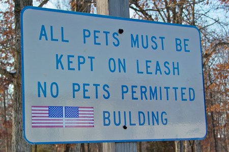 Sign pertaining to pets at the rest area, which is pretty standard for Virginia rest areas.  Note the double flag sticker.
