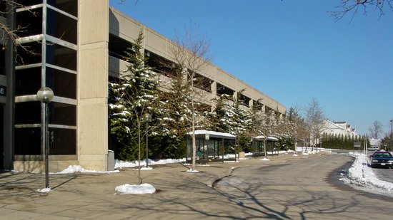 The Vienna north garage, viewed from the sidewalk.  The Fairfax City CUE buses load from the bus stands shown here.