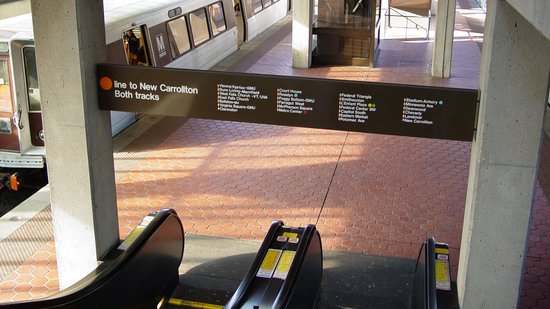 Signage on the platform at Vienna, viewed from the escalator.  I liked this version of the signage, because it explicitly indicated that trains to New Carrollton boarded from both tracks.