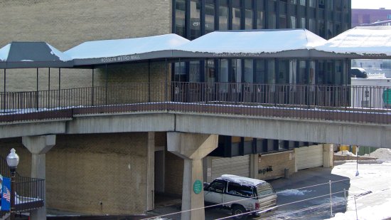 Skywalk over North Moore Street in Rosslyn.  Nothing that you see in this photo still exists, save for the River Place North condominium tower, a sliver of which is visible in the upper right corner of the shot.  Everything else that you see in this photo has been demolished.