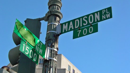 Street signs at the intersection of Madison Place NW and H Street NW, at the northeast corner of Lafayette Square.  I do not know why there is tape on the H Street sign.