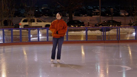 One of the skate guards takes the resurfaced ice for a quick spin before inviting the public back into the rink.