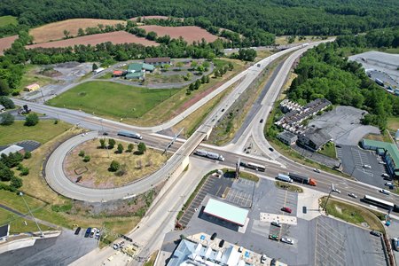 Breezewood interchange.  This interchange largely follows an old alignment of the turnpike mainline, after the road was rerouted in the 1960s to bypass two tunnels in order to eliminate traffic bottlenecks.