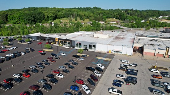 Former Sears building, much of which is now a car dealership.