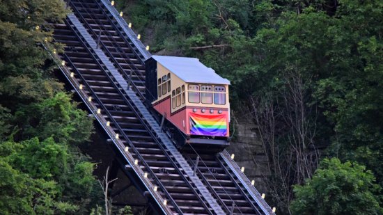 The western vehicle of the Monongahela Incline, decorated with a flag for Pride month.