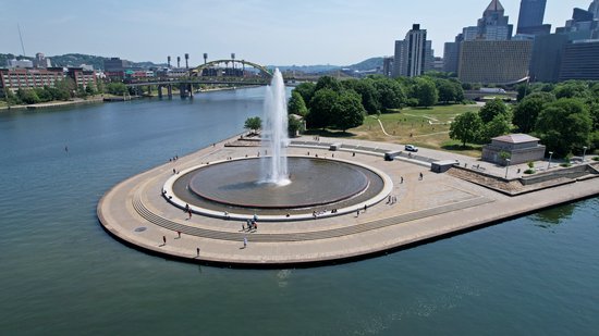 Point State Park, at the confluence of the Allegheny and Monongahela Rivers, together forming the Ohio River.  Pennsylvania prohibits drones in state parks, but nothing says that I can't fly around the state park without actually overflying it.