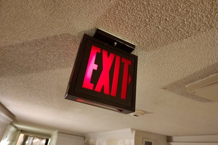 Old-style exit sign on the fifth floor of the Chelsea. This will be replaced by the international standard with the "running man" icon when work is complete.