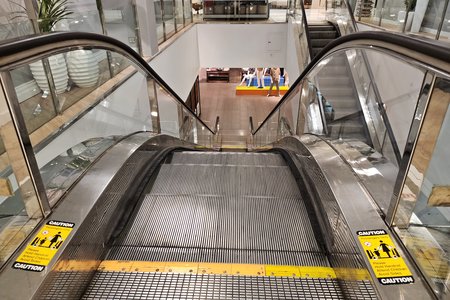 Down escalator between the sixth floor and the fifth floor.