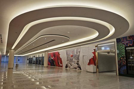 A corridor lined by unbuilt tenant spaces, on the third level.