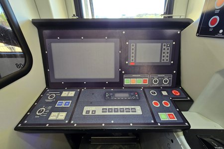 8000-Series operating console.  It is largely similar to the 7000-Series console, but with a slightly different button arrangement, and larger screens.