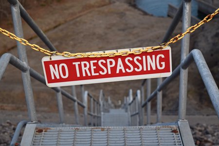 This "NO TRESPASSING" sign on the steps going down the river side of the dam is new, replacing an older, slightly wordier sign.