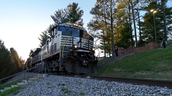Norfolk Southern locomotive 4426 leads a train on its way through campus.