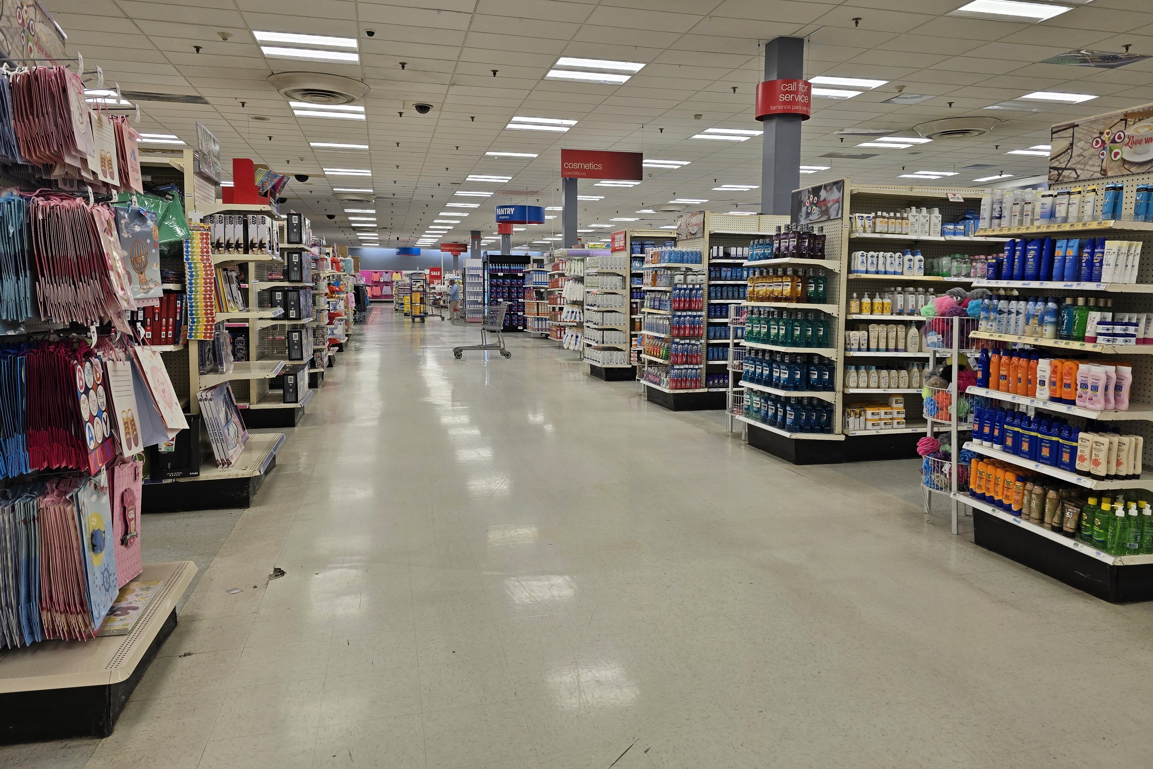 Back action alley at the Bridgehampton Kmart.  Note the mixture of Sears-acquisition-era signage, and later signage that matched the employee t-shirts.