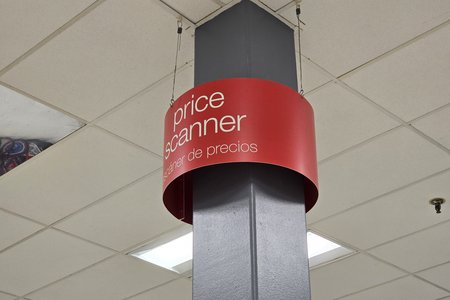 2000s-era Sears-style price scanner sign on a structural column.