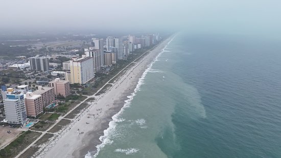 Looking south and north along Myrtle Beach near 17th Avenue North.  Note that the water is cloudy near the beach, and gets clearer once you get a little bit offshore.