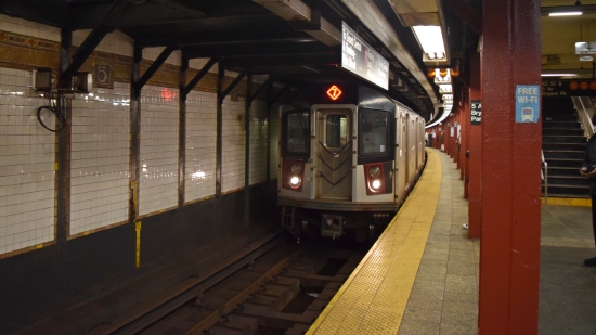 A 7 train consisting of R142 cars arrives at 42nd Street-Bryant Park/Fifth Avenue station.