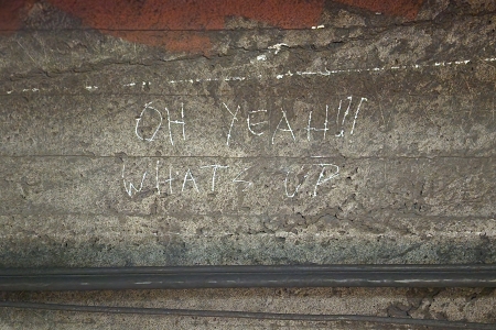 Close up of that "OH YEAH!!! WHAT'S UP" graffiti in the tunnel on the City Hall loop.