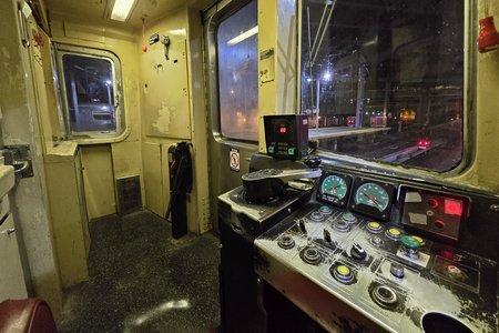 Operator's cab on car 392.  This is a much older design than the cabs that I'm accustomed to working in, but it still looks quite familiar, as a train is a train to a certain extent.  I was most surprised that the emergency brake was a pull cord above the operator, while my agency's trains use a red mushroom-shaped button on the operator's console.