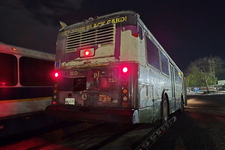 Here, she is partially off of the trailer, with her front wheels on pavement, and the rear wheels still on the trailer.