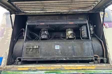 Looking around on the air conditioner unit for a serial number in order to get repairs started.  As it would turn out, the serial number that I was looking for was on the inside of the bus (and it took a long time to find because it was covered with a thick layer of dust), but I didn't know that at the time.