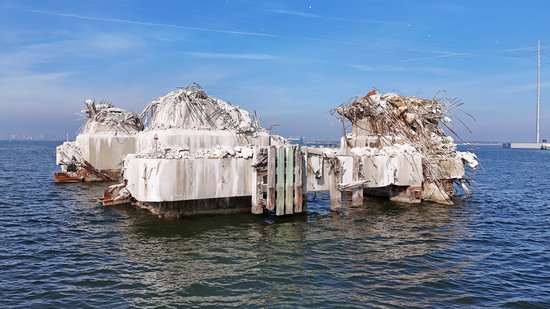 This is the pier that was struck by the Dali, identical to the triangular pier above.  The pier was sheared off close to the waterline, and based on the bridge's design as a continuous truss structure, there was no way that it would have been able to remain standing with such a critical pier missing.