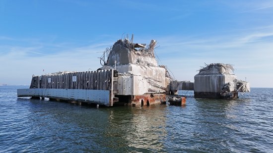 This is the pier that was struck by the Dali, identical to the triangular pier above.  The pier was sheared off close to the waterline, and based on the bridge's design as a continuous truss structure, there was no way that it would have been able to remain standing with such a critical pier missing.