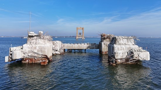 This is the pier that was struck by the Dali, identical to the triangular pier above.  The pier was sheared off close to the waterline, and based on the bridge's design as a continuous truss structure, there was no way that it would have been able to remain standing with such a critical pier missing.