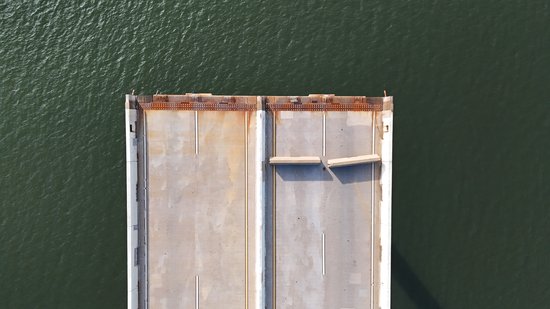 The edge of the roadway on the Hawkins Point side, looking straight down.